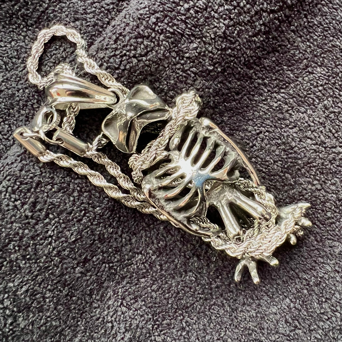 Close-up of owl skeleton pendant necklace with silver-tone chain